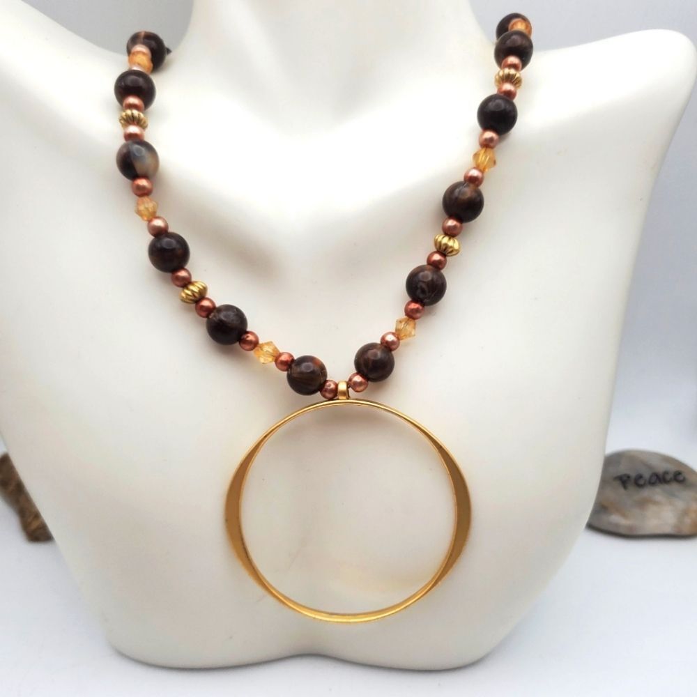 Gold Toned openwork ring Tibetan necklace